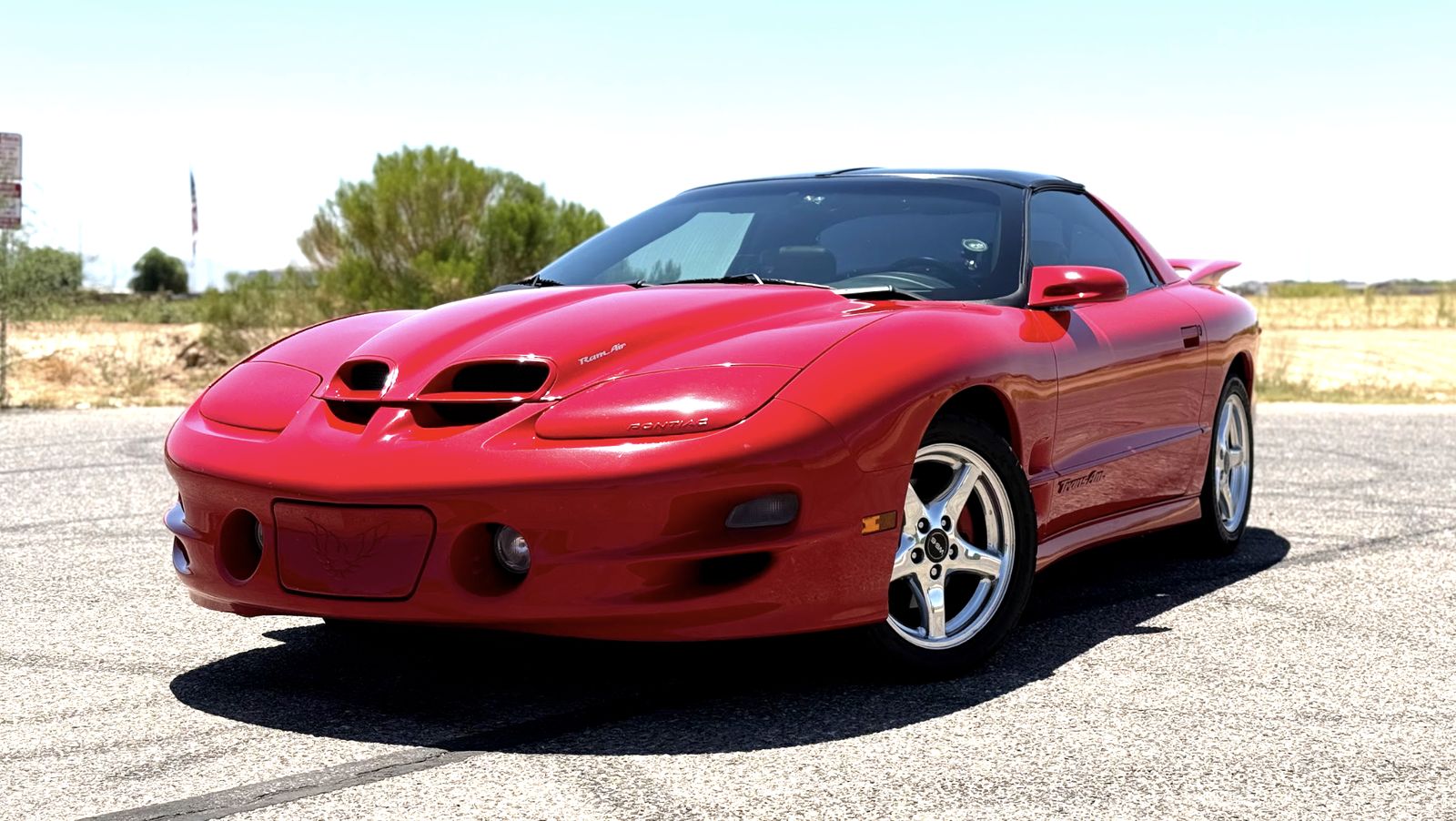 Red 1998 Trans Am parked outdoors